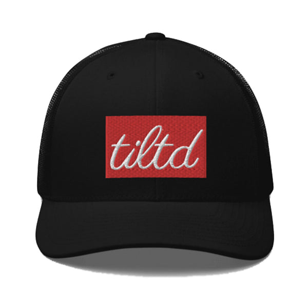 The "TILTD Trucker" hat